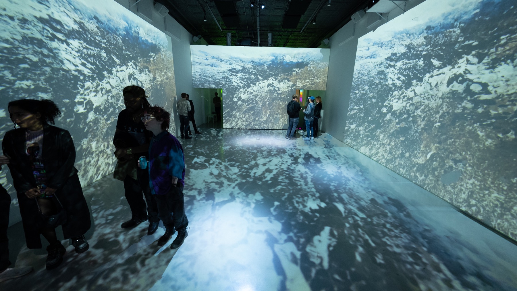 Ocean waves projected around guests in the Immersive Studio