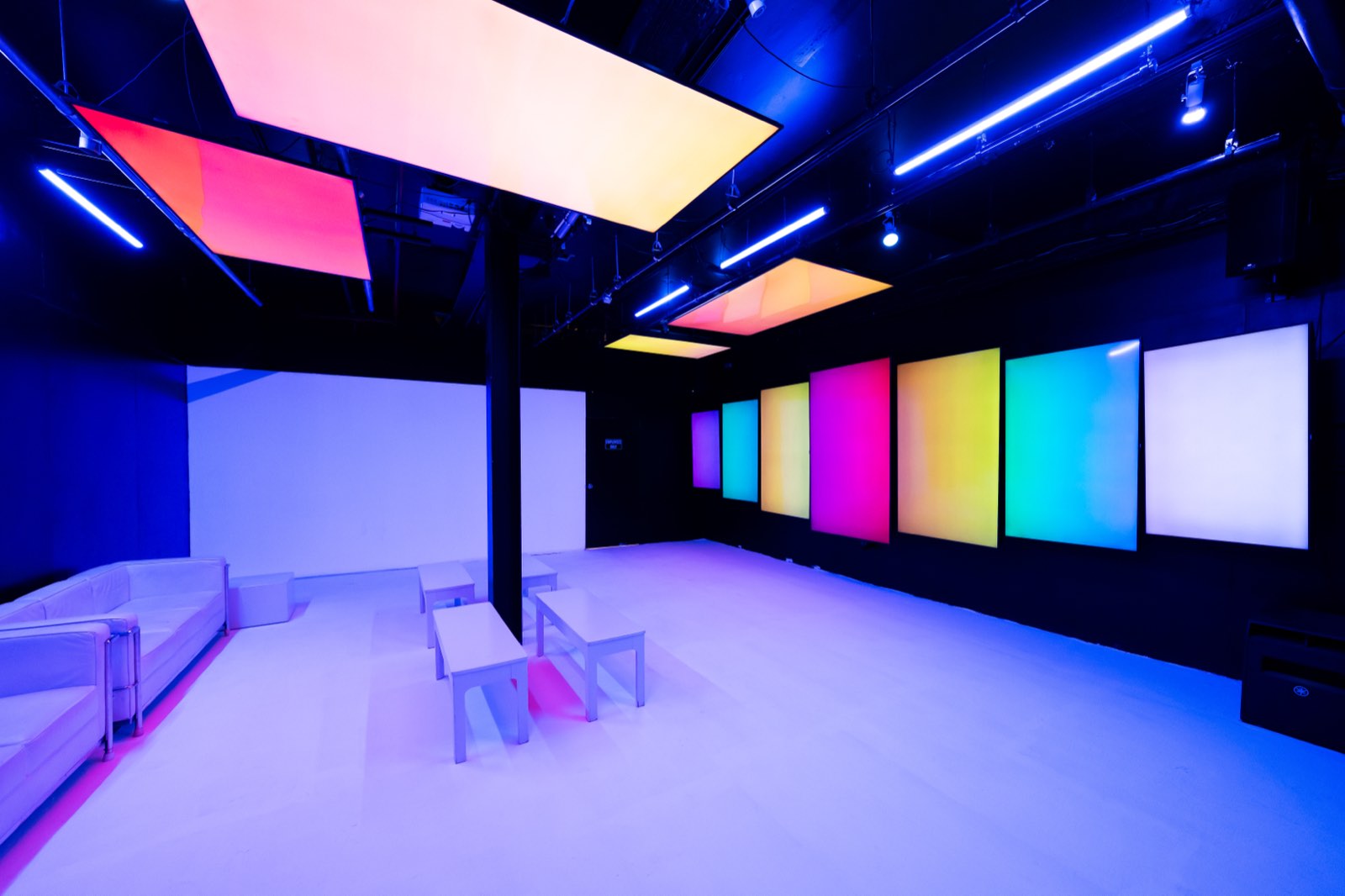 Basement Lounge from the entrance with screens along the wall