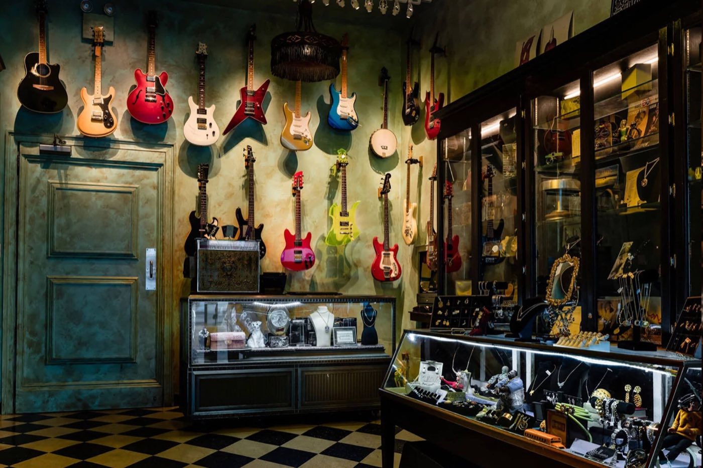 Pawn shop entrance with guitars on the wall and jewelry display cases