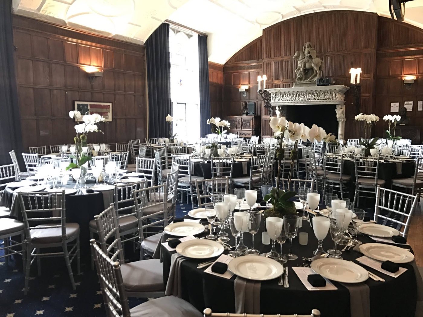 Clark Room set with round dinner tables for a seated fundraiser dinner