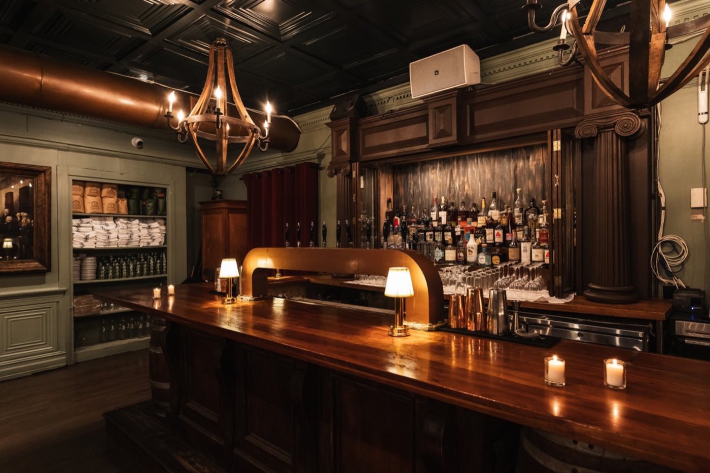 Private bar in the Bissell Room with a carved wood back bar and candles