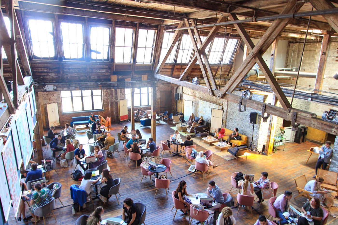 Overhead view of an event in the loft with guests at lounge seating