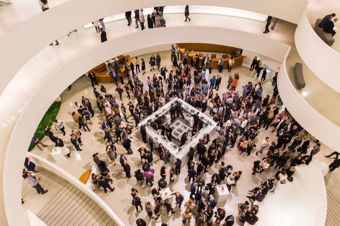 Standing reception on the rotunda floor viewed from an upper ramp