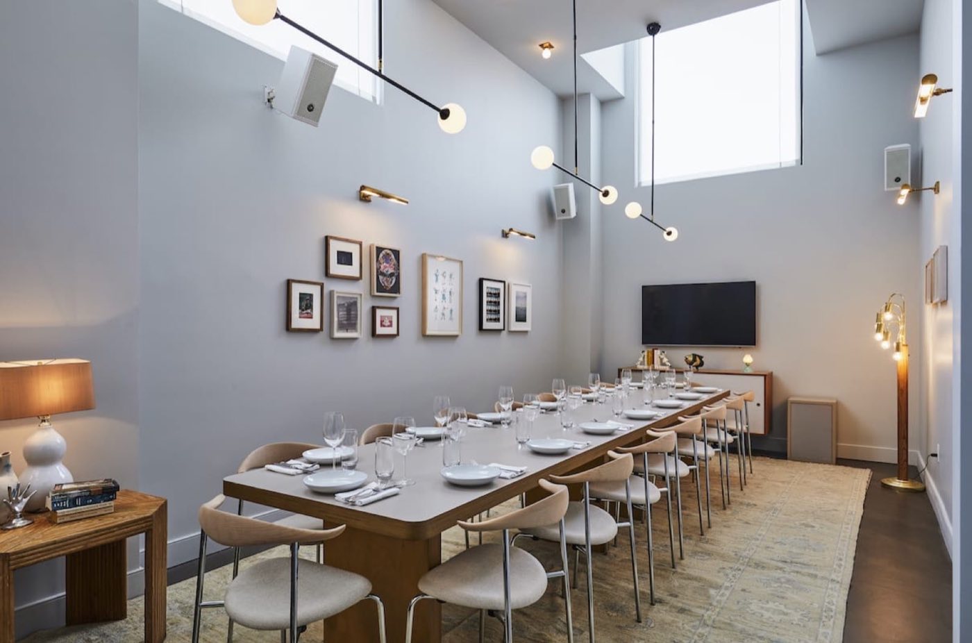 The Apartment room with a long table for a seated dinner or meeting