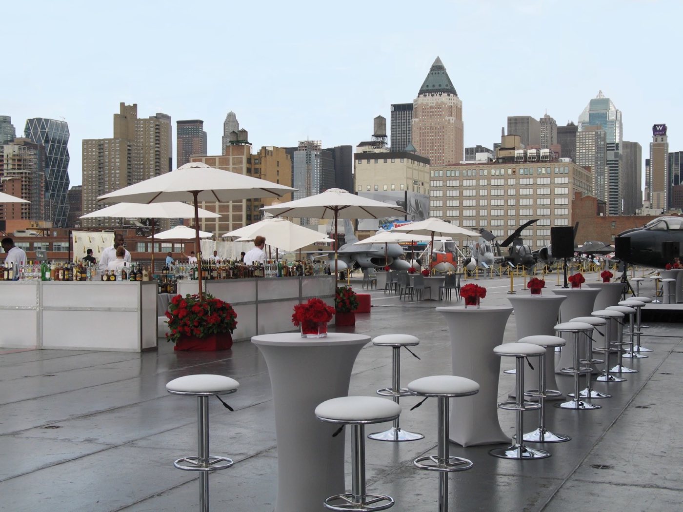 Flight deck set with umbrellas, bars and cocktail tables against the Midtown skyline