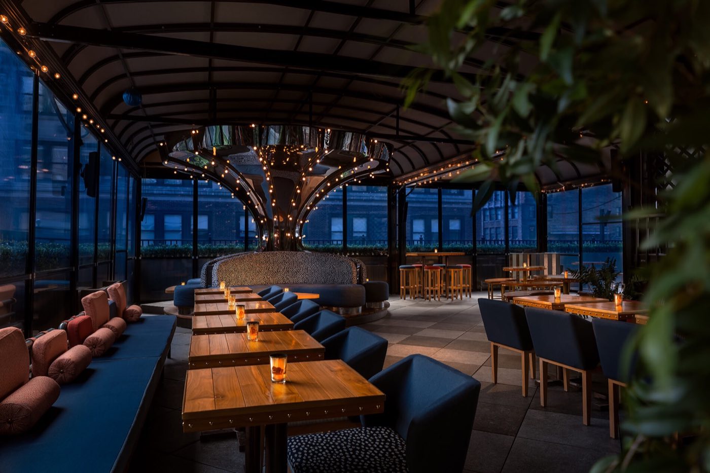 West Terrace with the roof closed and glass walls, set with long tables