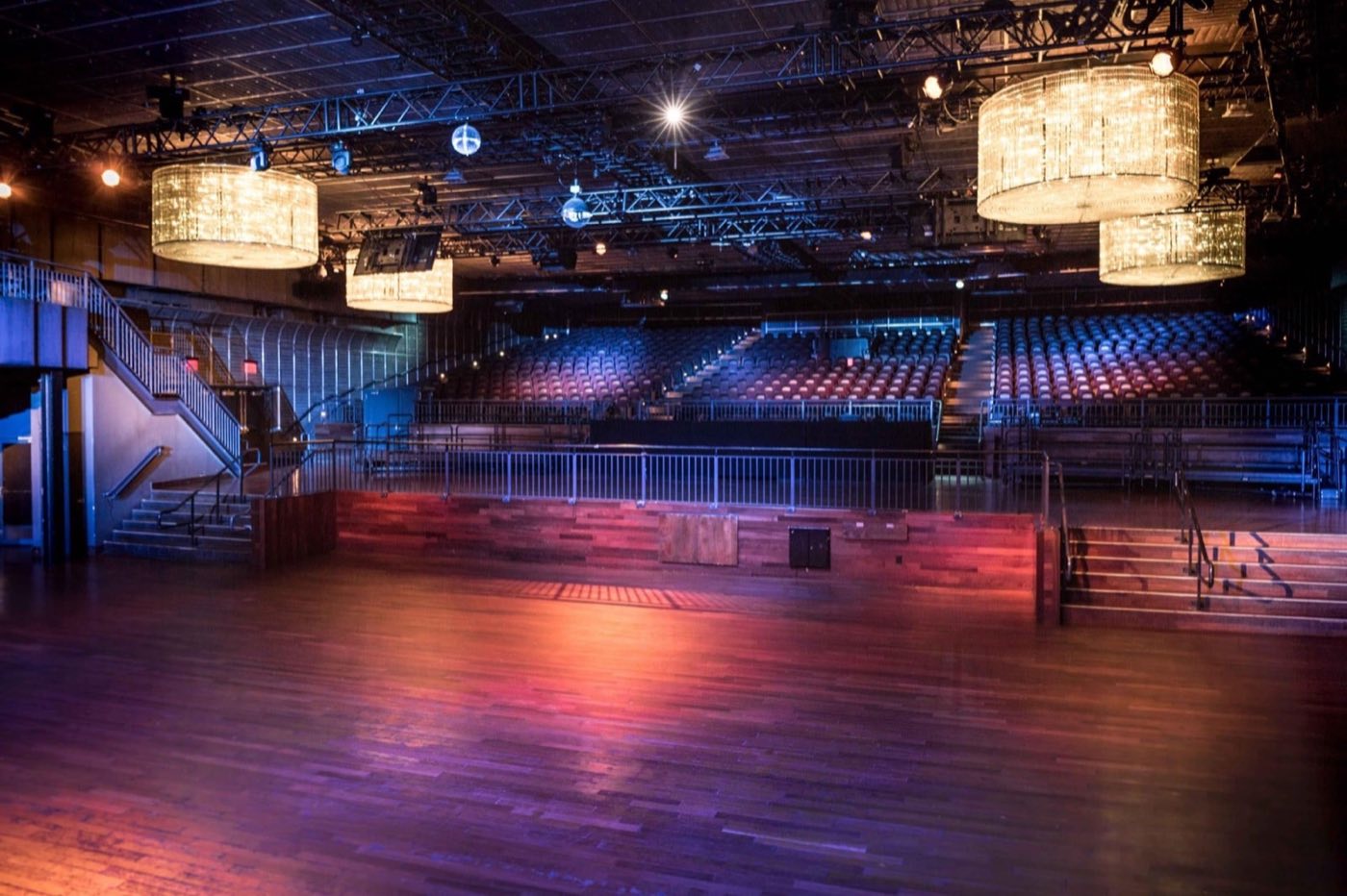 Main floor with crystal chandeliers, open dance floor and balcony seating