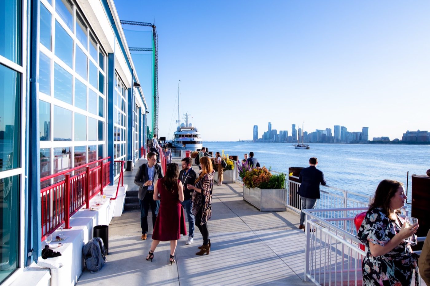 Outdoor promenade along the pier with river and Jersey City skyline views