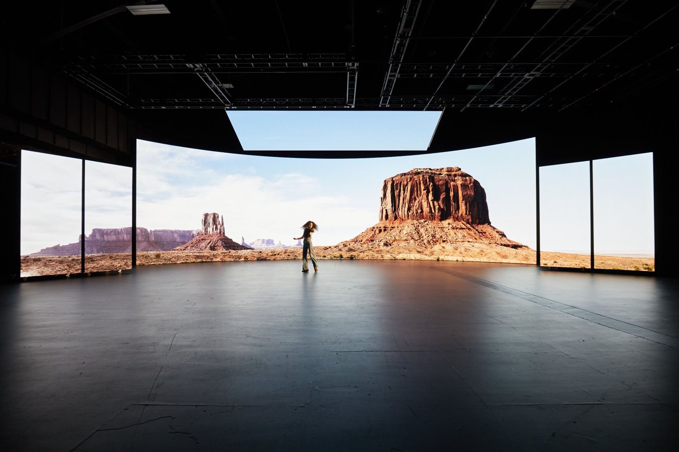 Stage C with a curved LED wall and LED ceiling showing a desert scene