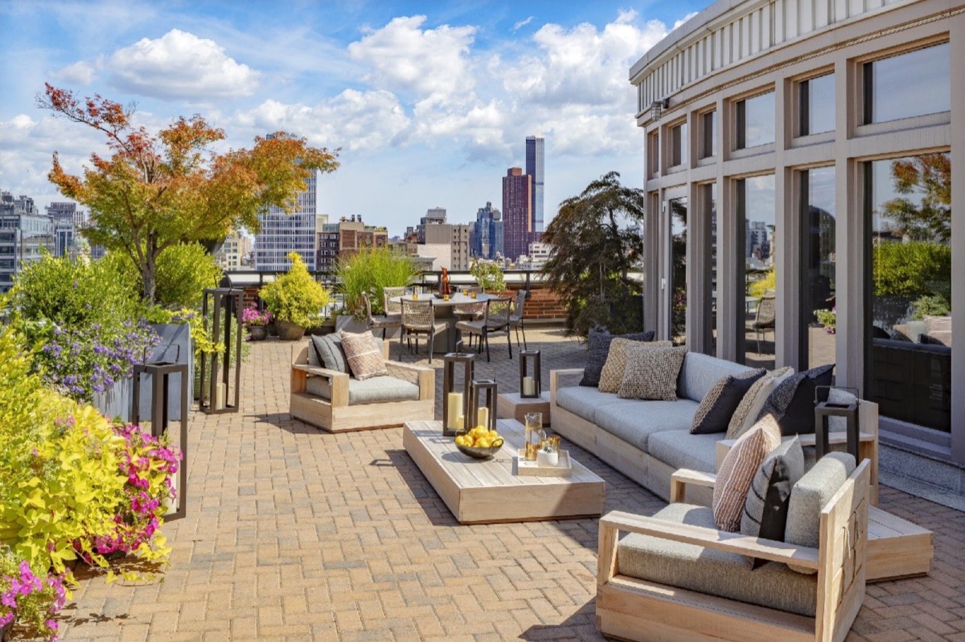 Loft north terrace with lounge seating, planted borders and city views