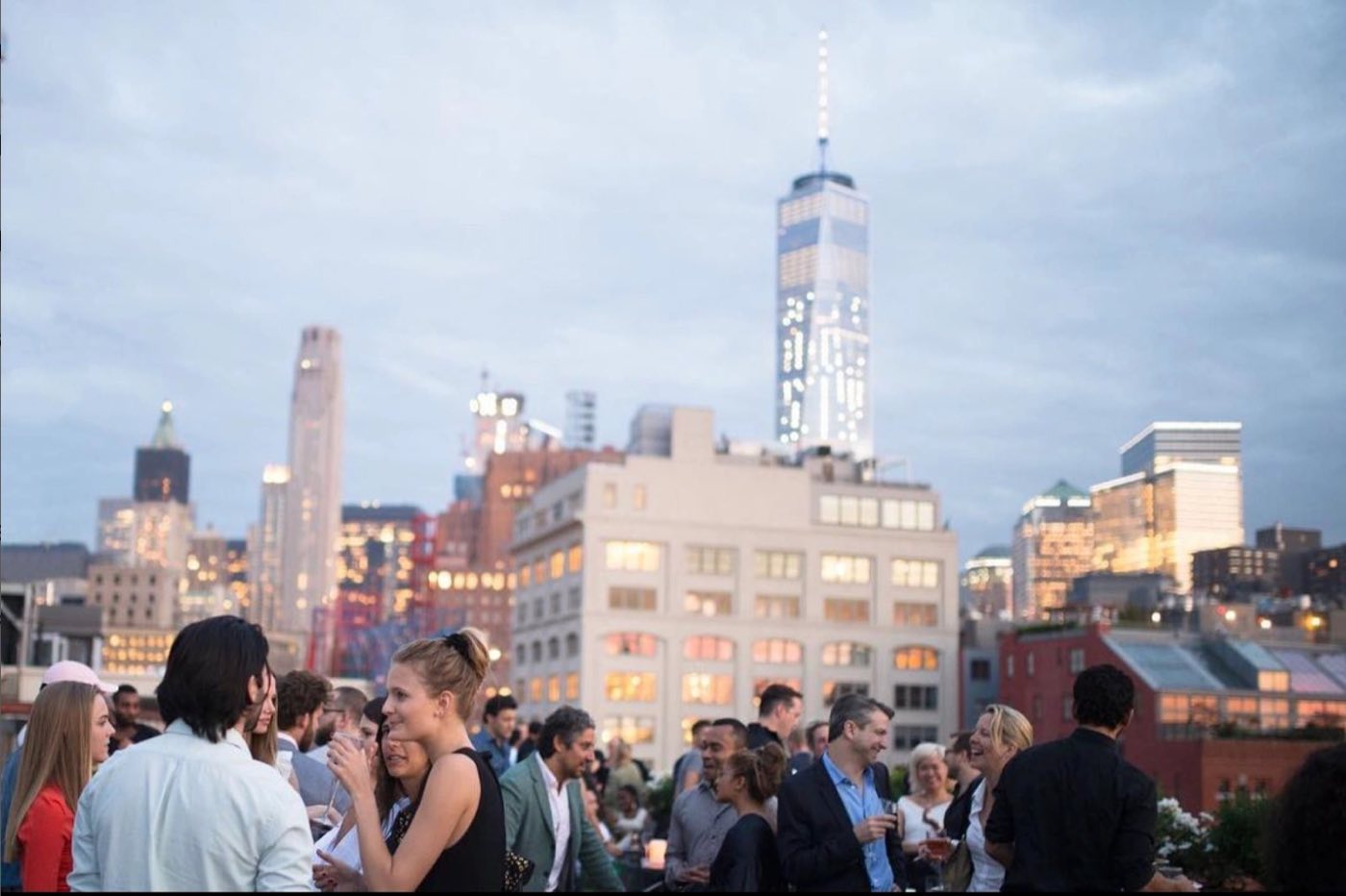 Evening reception on the roof terrace with the downtown skyline