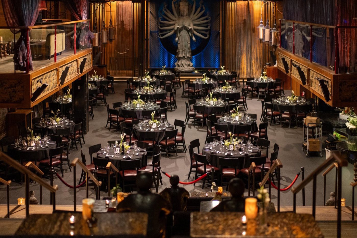 Main dining room set with round banquet tables below the giant Quan Yin statue