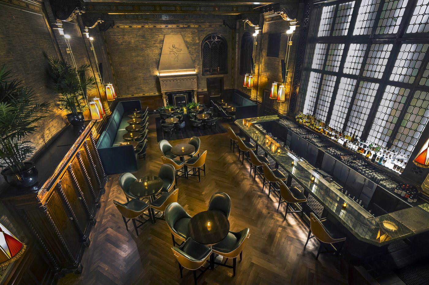 Overhead view of the main bar room with leaded window, lounge seating and long bar
