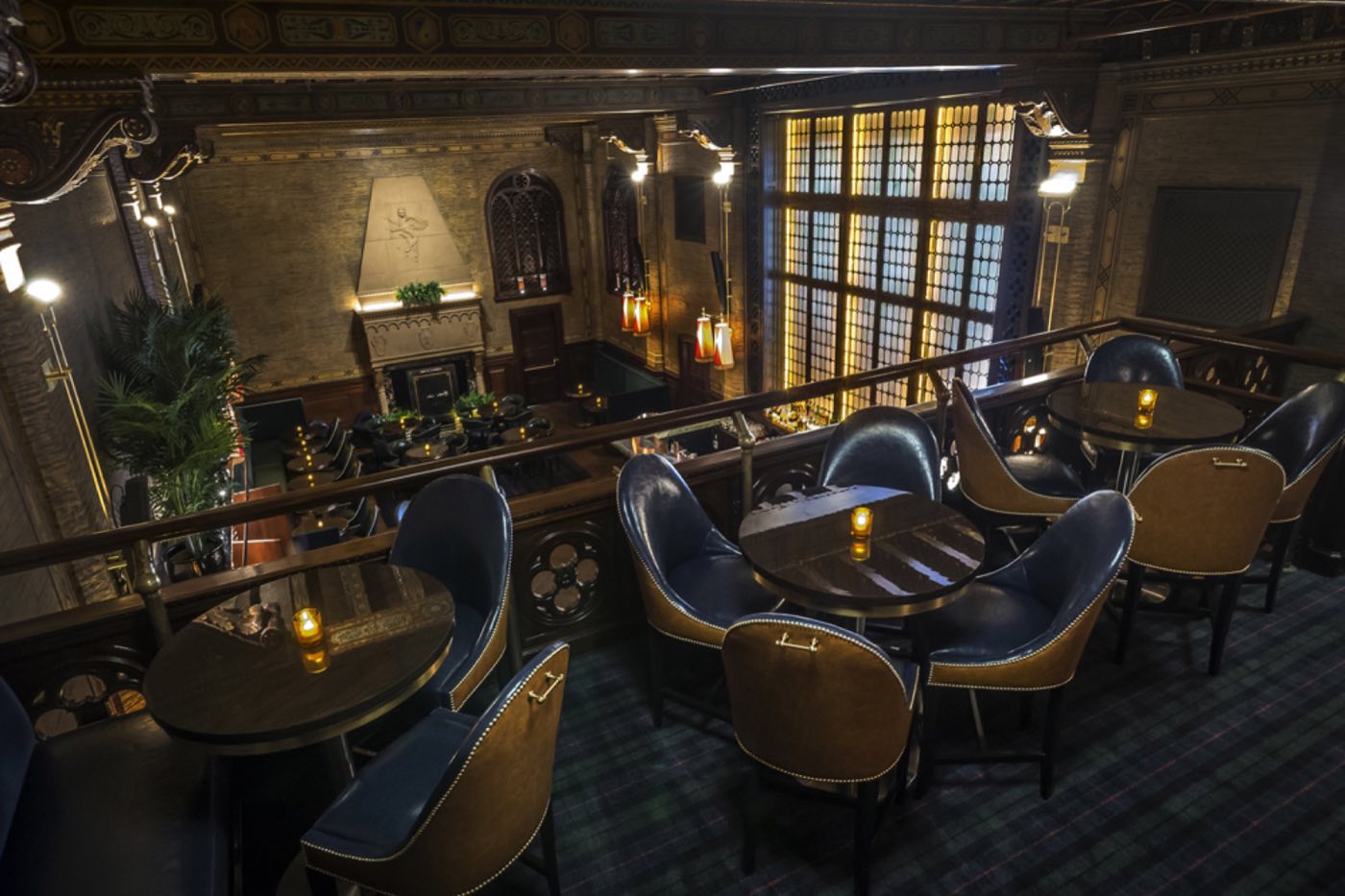 Mezzanine balcony seating looking down into the bar under the painted ceiling