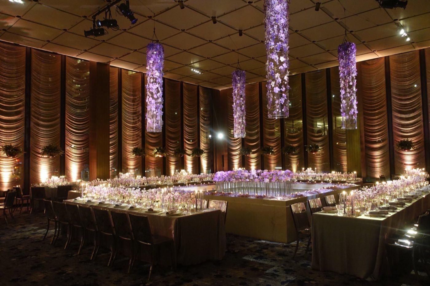 The Pool room set for a seated dinner around the white marble pool