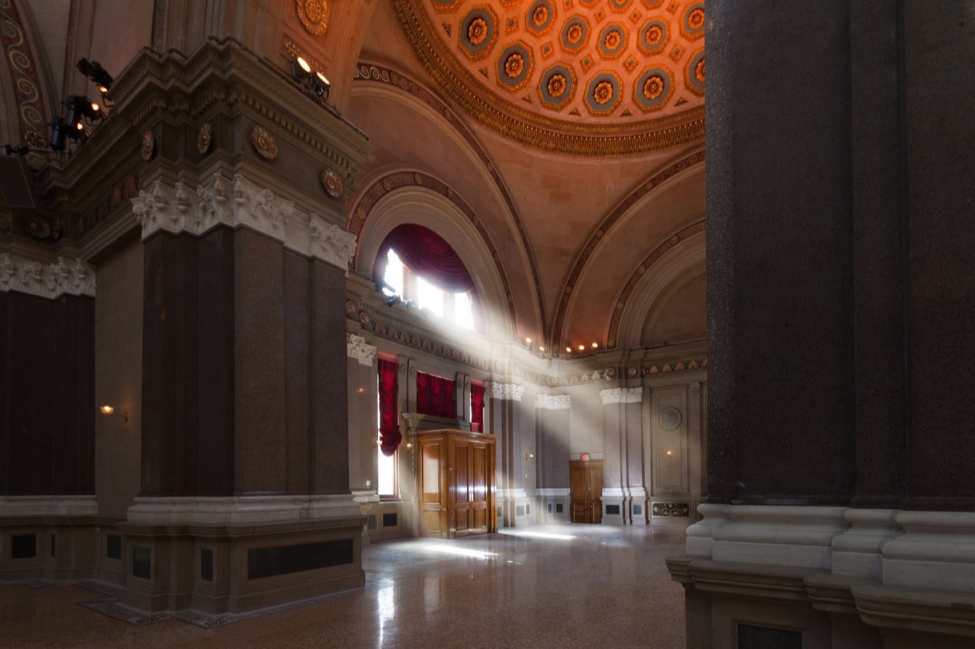 Main rotunda interior with marble columns, painted dome and daylight